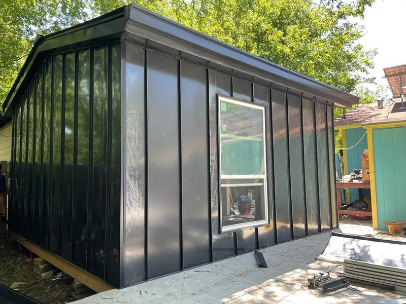 Black standing seam metal wall panels for Roof Inspection in Houma